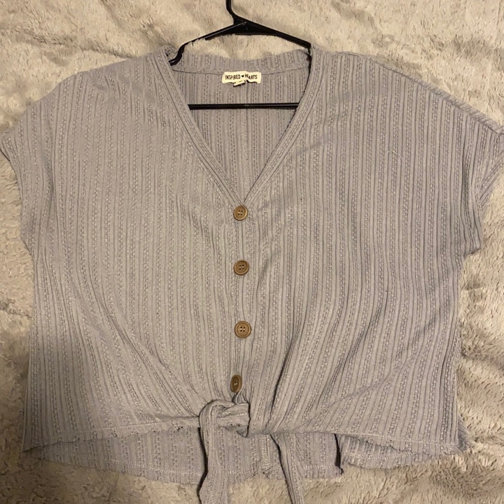 Button down top with tie at the bottom.